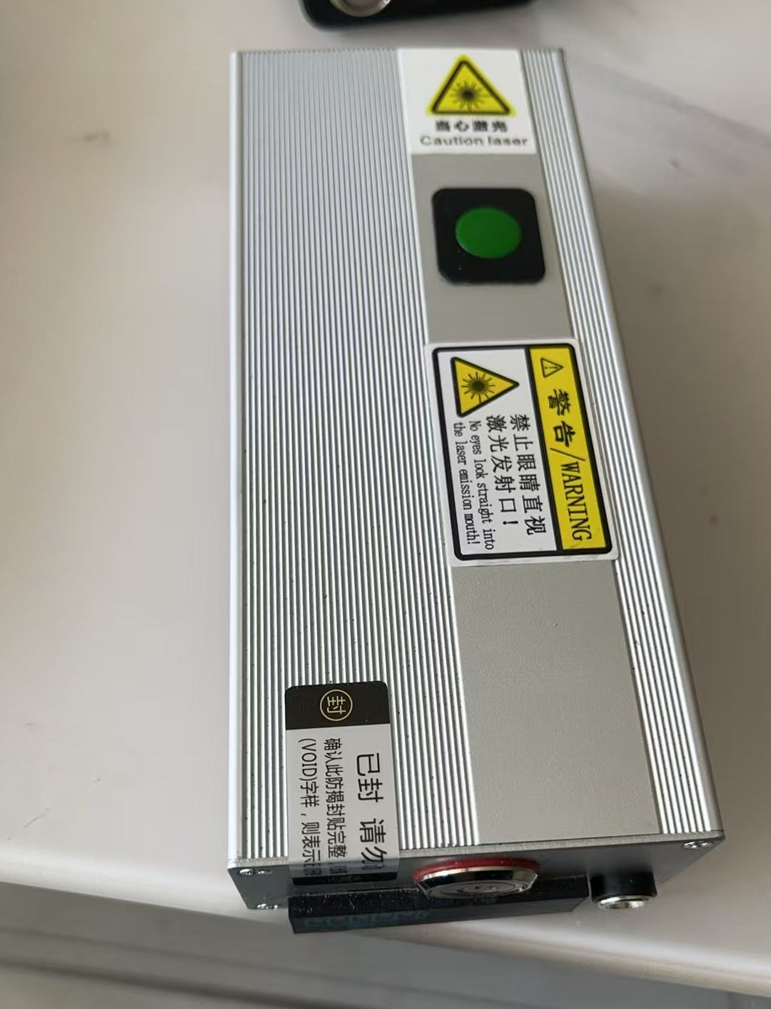 Pump source handheld laser transmitter